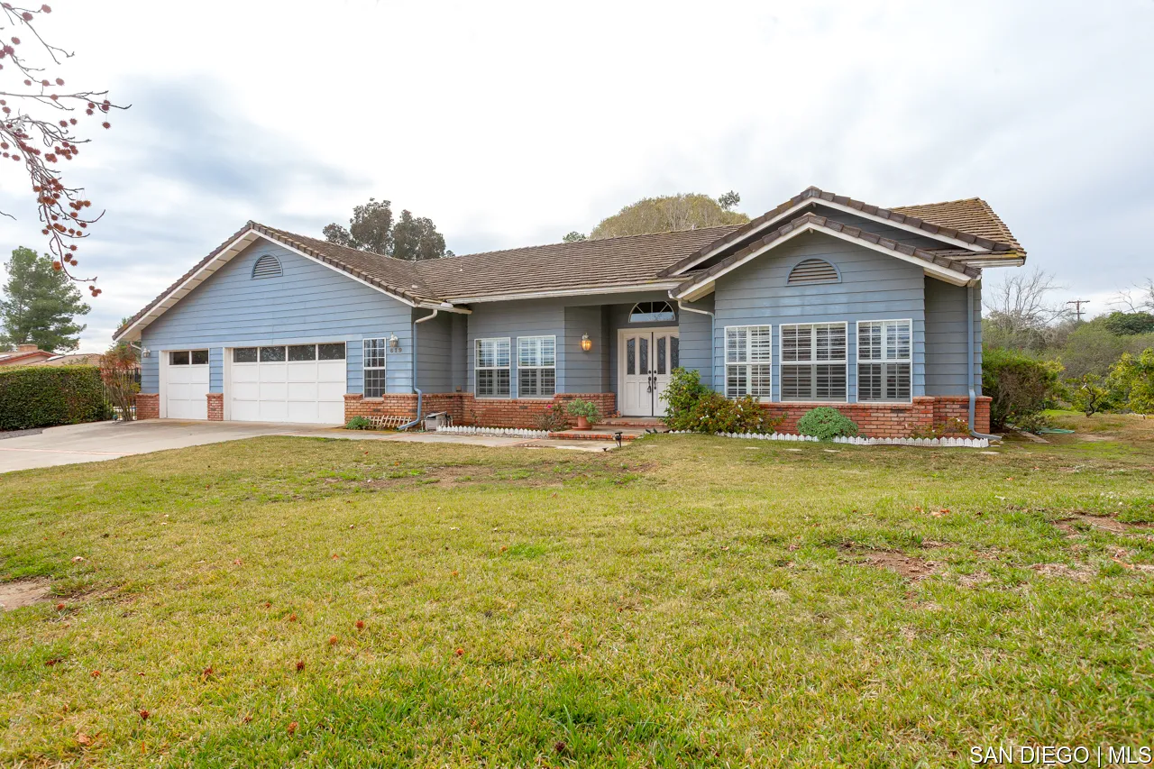 619 Elm Tree Lane Fallbrook, CA 92028 - Photo 1 of 28 a front view of a house with swimming pool