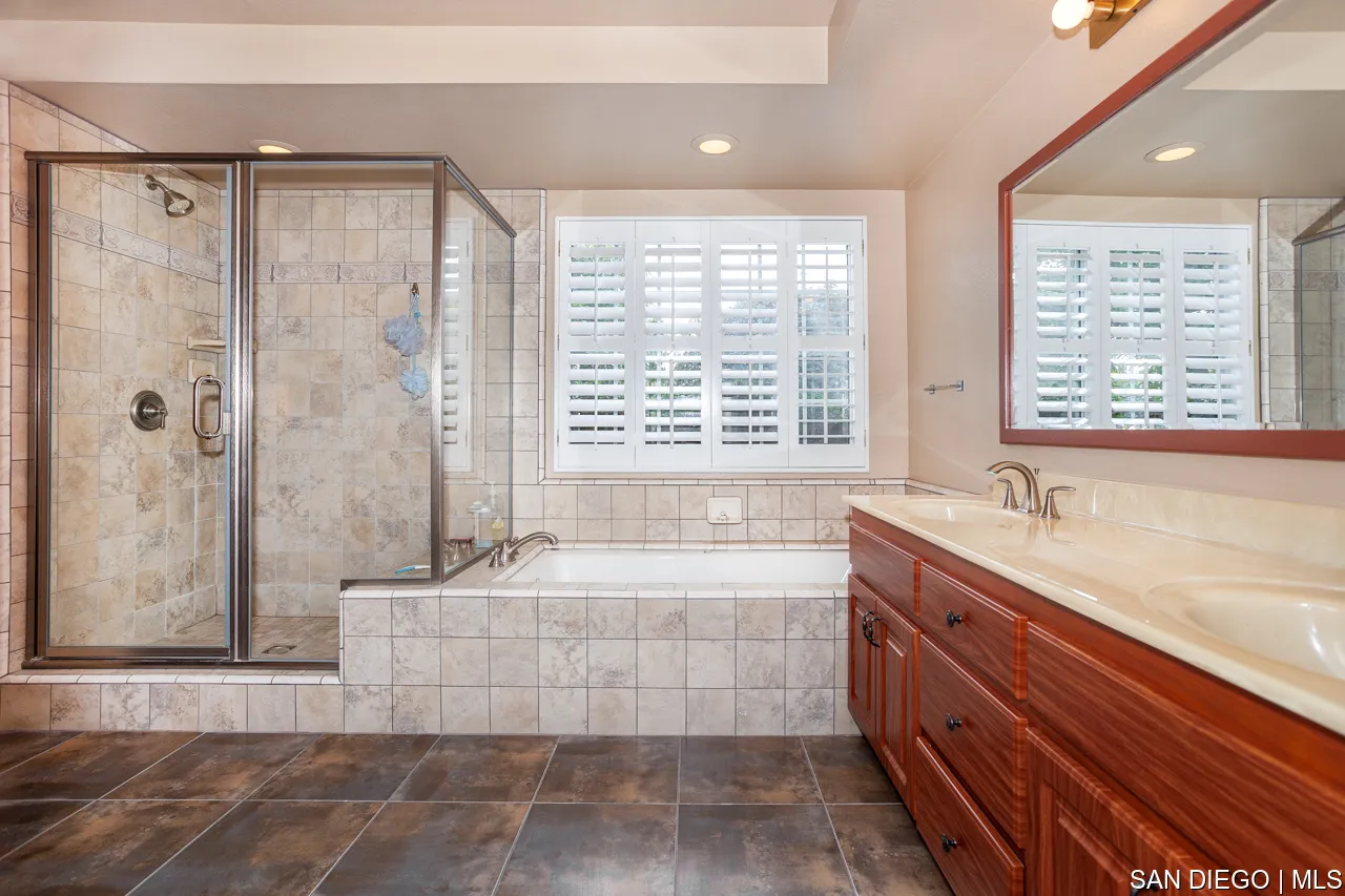 619 Elm Tree Lane Fallbrook, CA 92028 - Photo 13 of 28 a bathroom with a tub a sink and a shower
