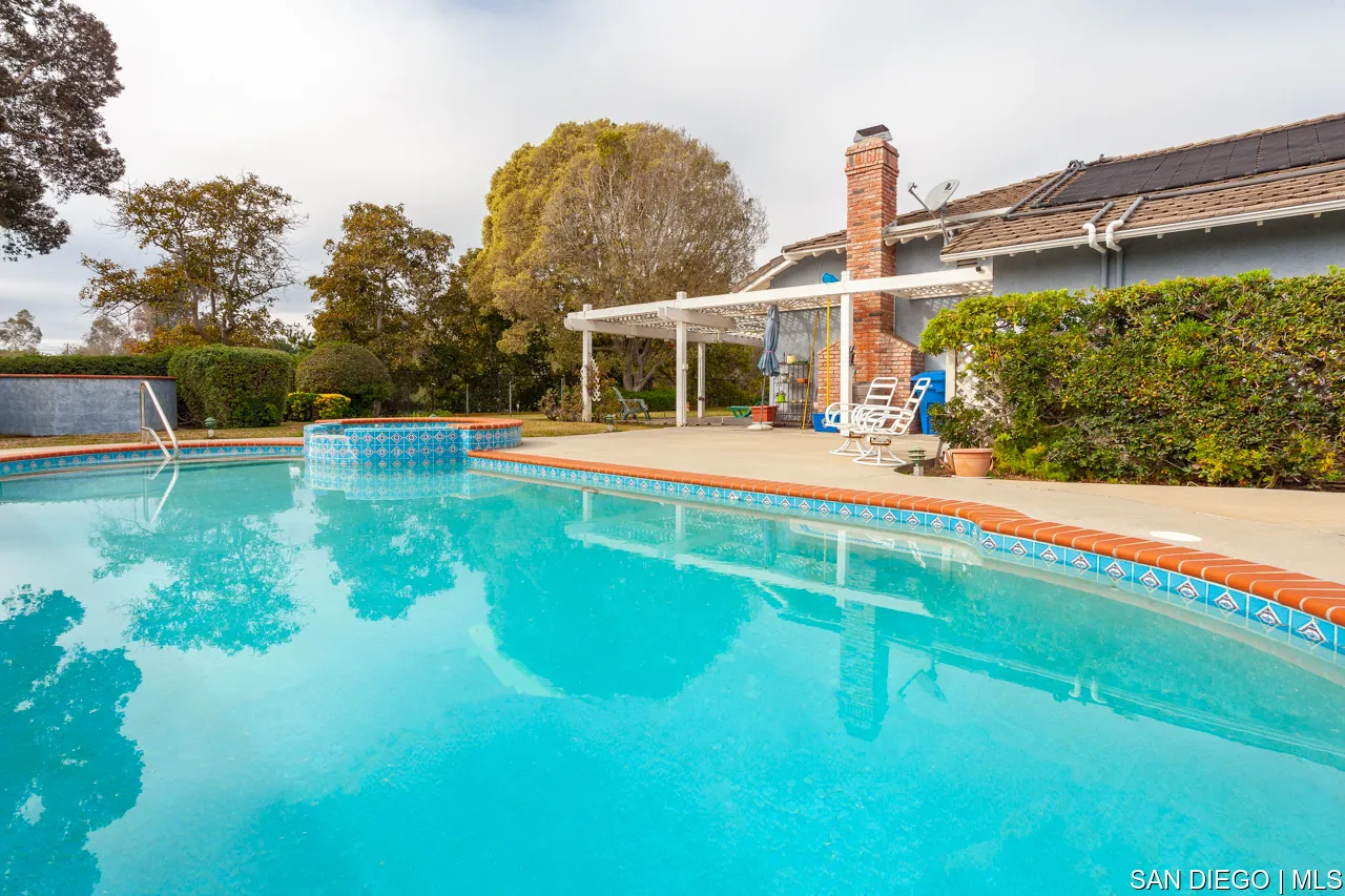 619 Elm Tree Lane Fallbrook, CA 92028 - Photo 17 of 28 a view of a house with a backyard and a patio