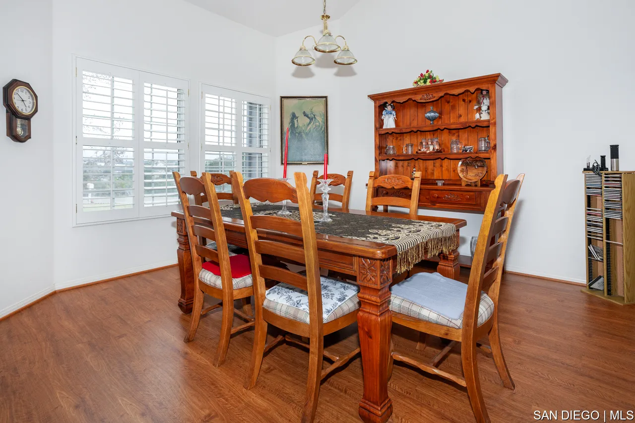 619 Elm Tree Lane Fallbrook, CA 92028 - Photo 3 of 28 a view of a dining room with furniture window and wooden floor