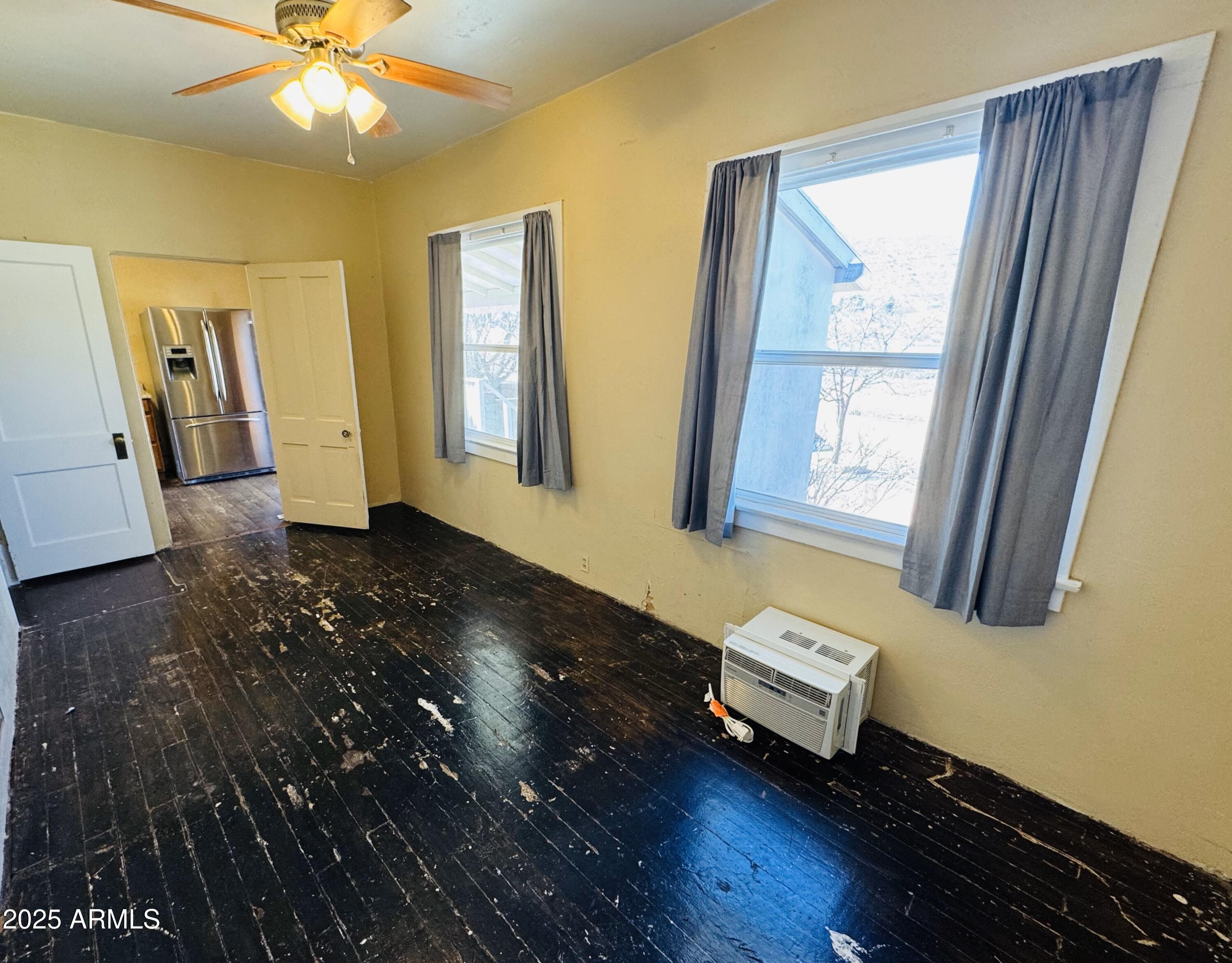 507 Bisbee Road Bisbee, AZ 85603 - Photo 11 of 26 a living room with hard wood floors and a window