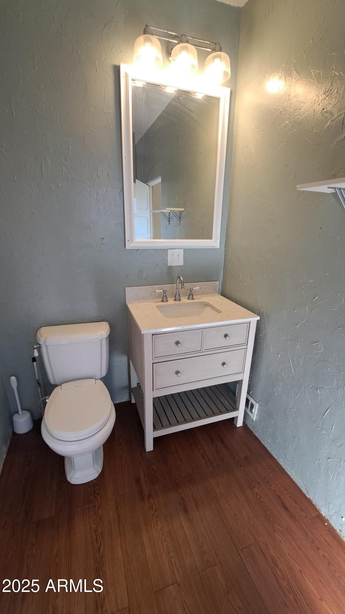 507 Bisbee Road Bisbee, AZ 85603 - Photo 12 of 26 a bathroom with a toilet sink and mirror