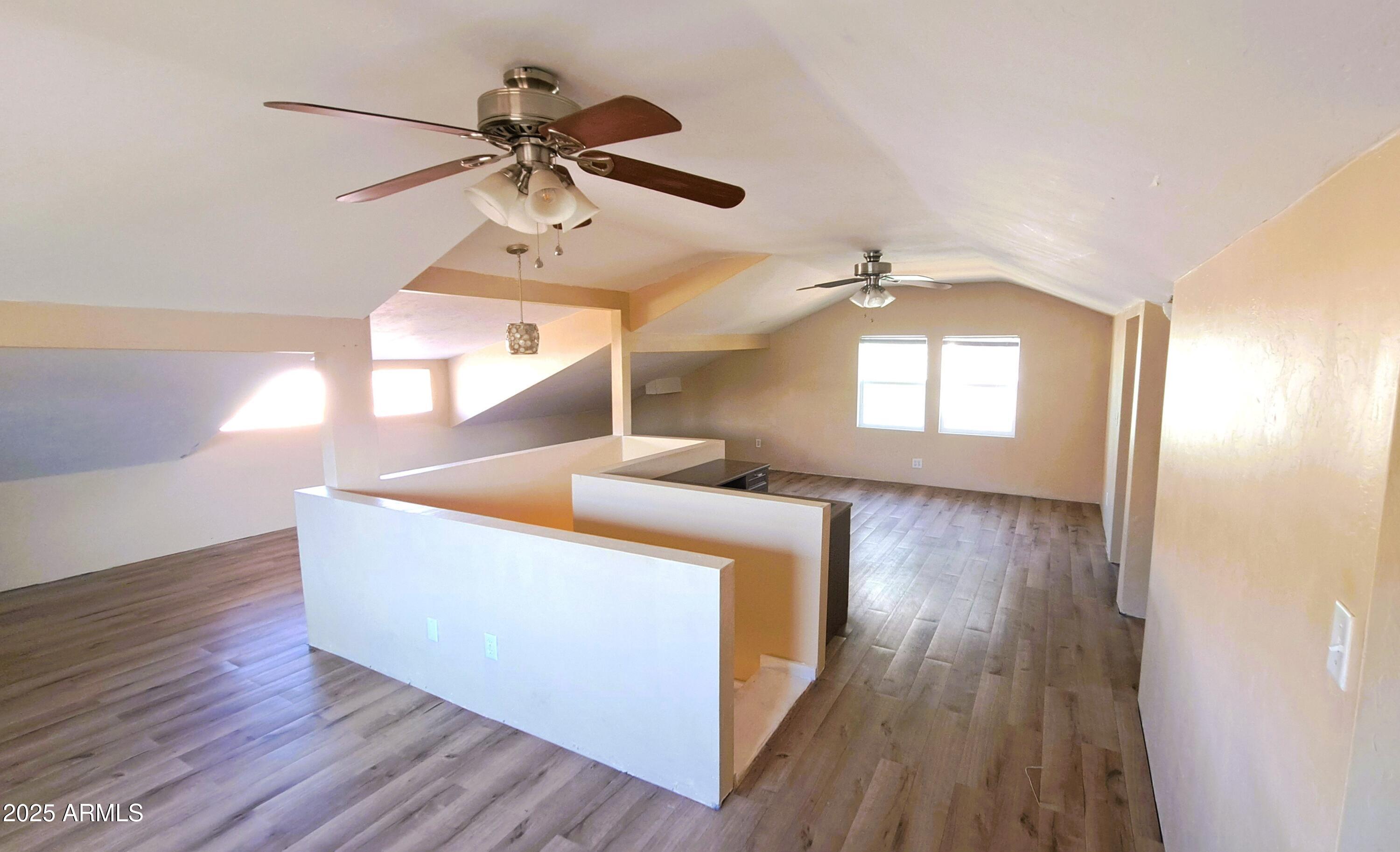 507 Bisbee Road Bisbee, AZ 85603 - Photo 14 of 26 a view of an entryway with wooden floor and a ceiling fan