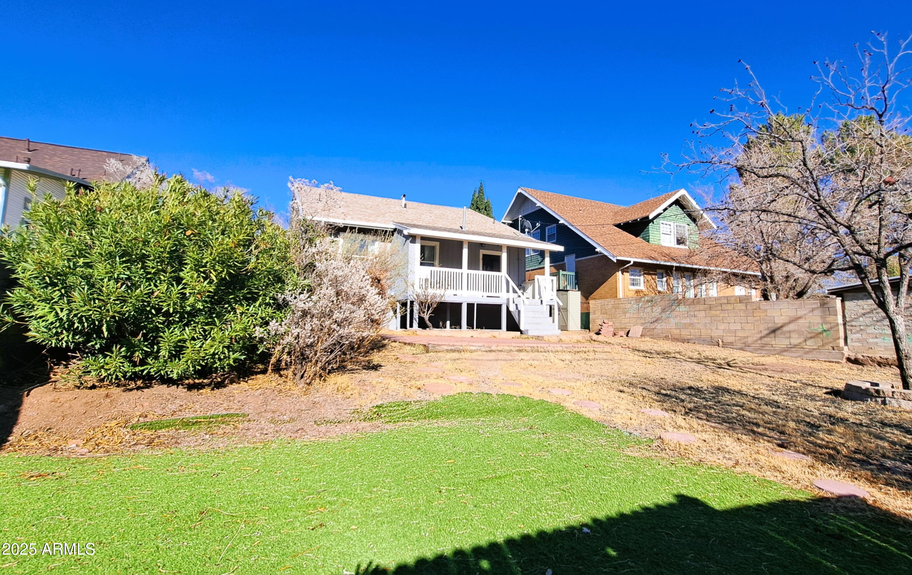 507 Bisbee Road Bisbee, AZ 85603 - Photo 20 of 26 a front view of a house with a yard