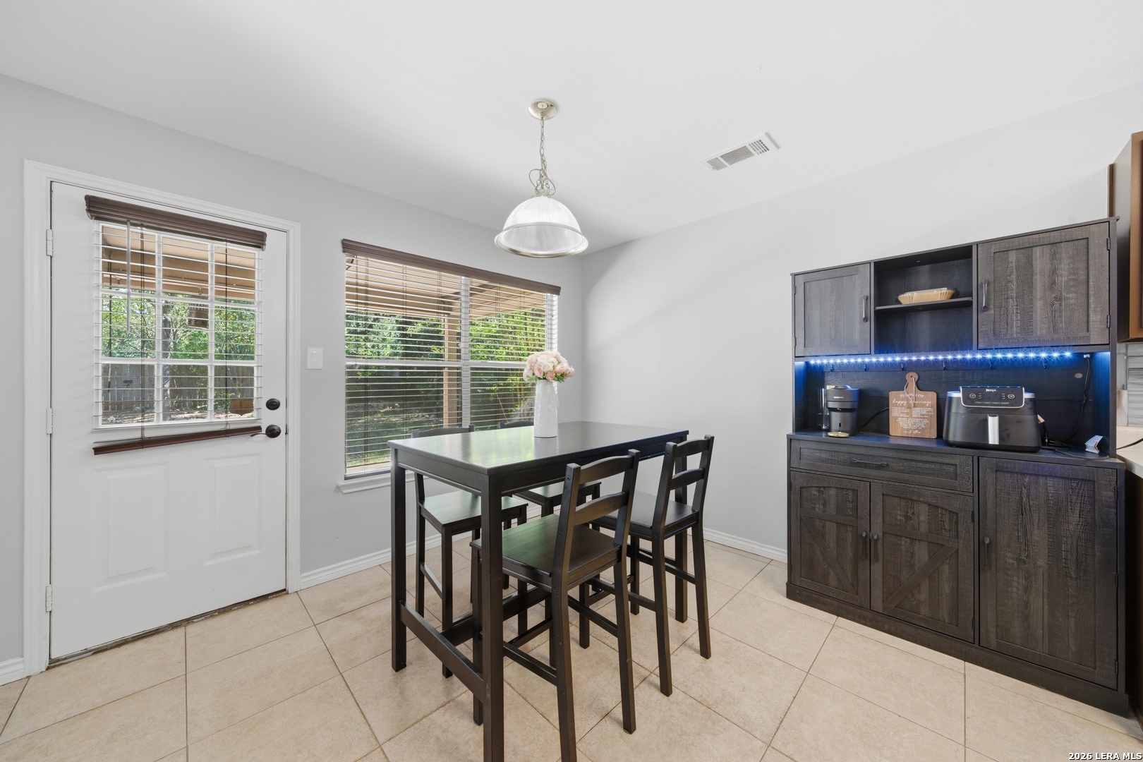 11622 Shotgun Way Helotes, TX 78023 - Photo 15 of 35 a dining room with furniture and window