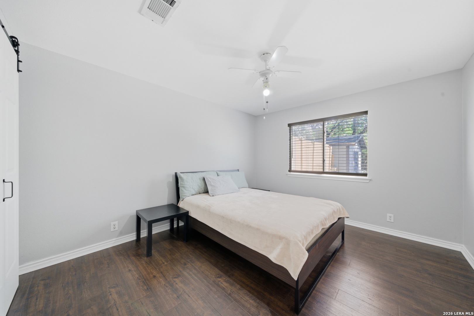 11622 Shotgun Way Helotes, TX 78023 - Photo 17 of 35 a bedroom with a bed and a window