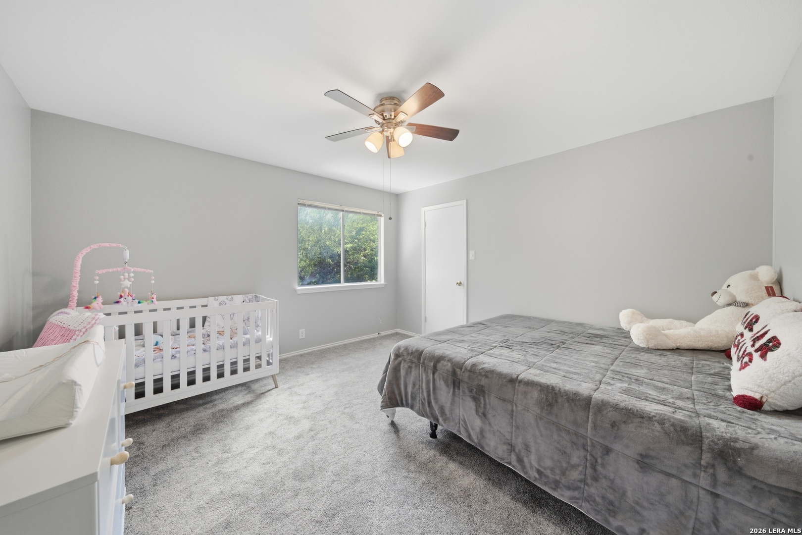 11622 Shotgun Way Helotes, TX 78023 - Photo 29 of 35 a bedroom with a bed and a window