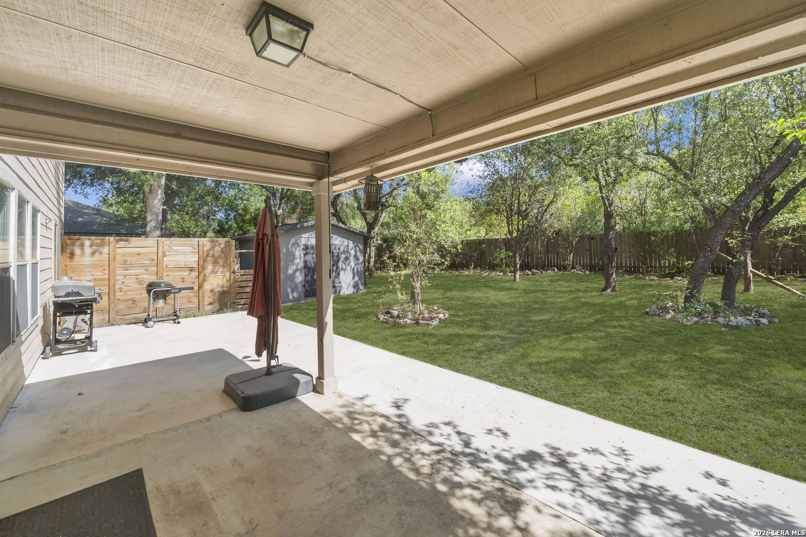 11622 Shotgun Way Helotes, TX 78023 - Photo 32 of 35 a view of a patio with a backyard