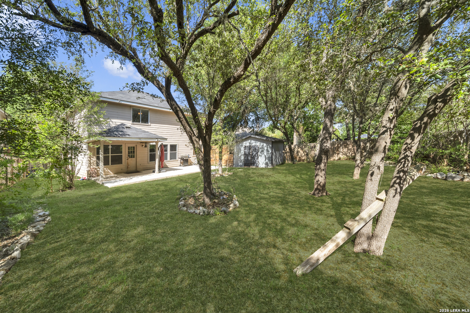 11622 Shotgun Way Helotes, TX 78023 - Photo 33 of 35 a front view of a house with a yard