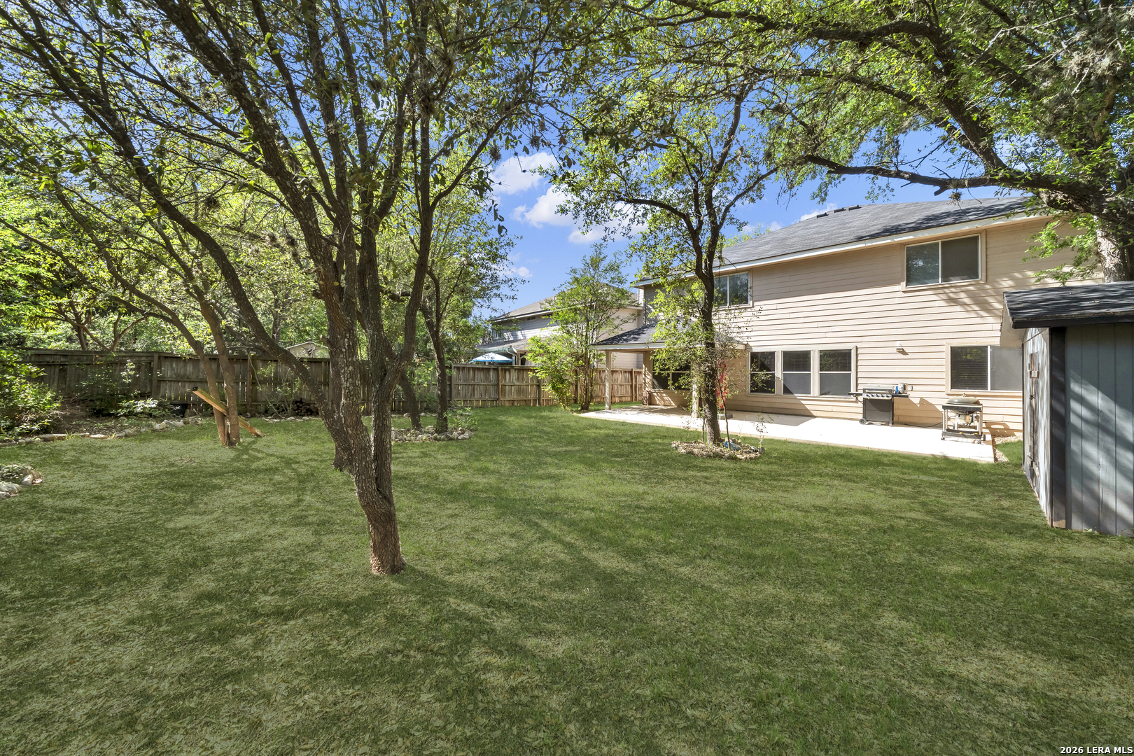 11622 Shotgun Way Helotes, TX 78023 - Photo 34 of 35 a view of a house with a yard