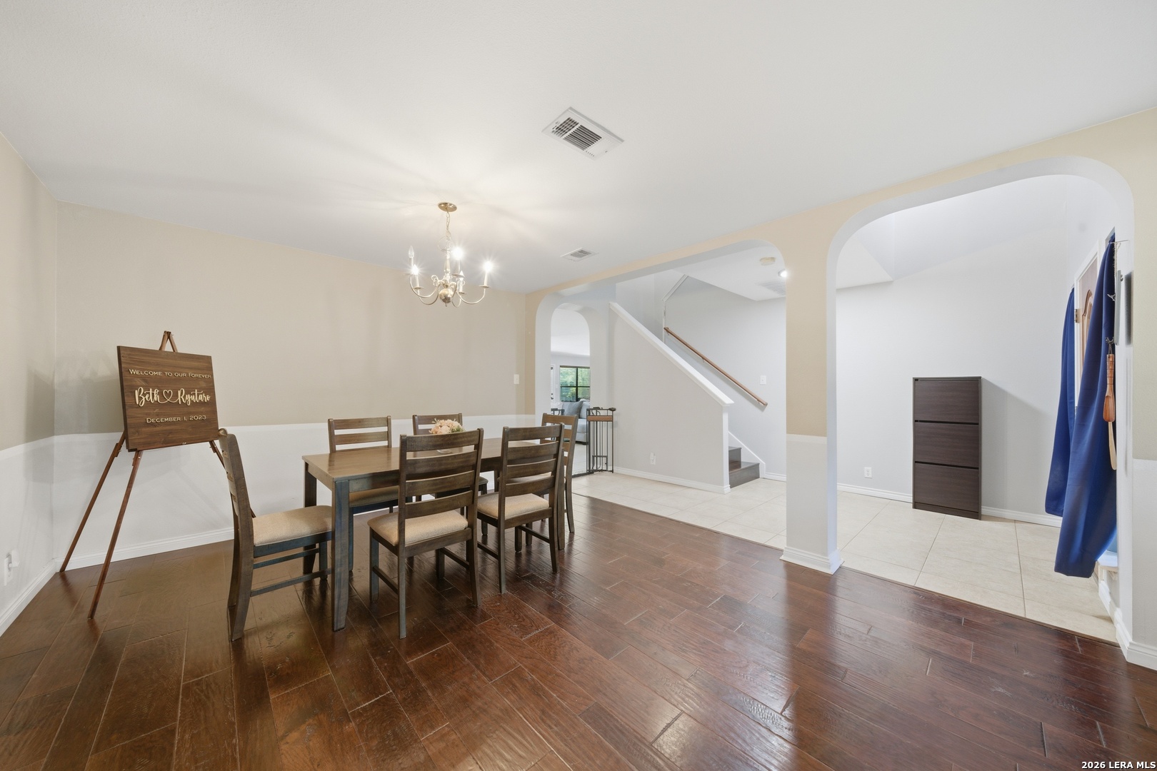 11622 Shotgun Way Helotes, TX 78023 - Photo 7 of 35 a view of a dining room with furniture and wooden floor