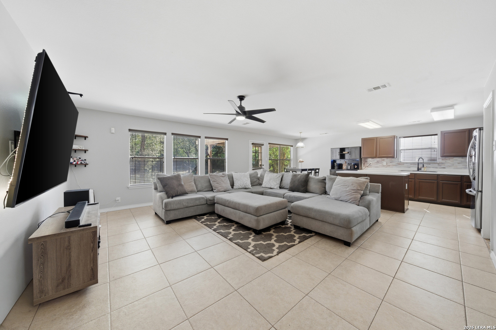 11622 Shotgun Way Helotes, TX 78023 - Photo 8 of 35 a living room with furniture and a flat screen tv