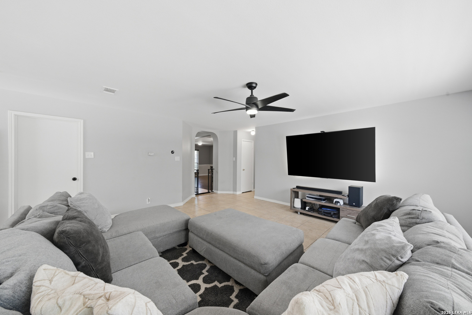 11622 Shotgun Way Helotes, TX 78023 - Photo 9 of 35 a living room with furniture and a flat screen tv