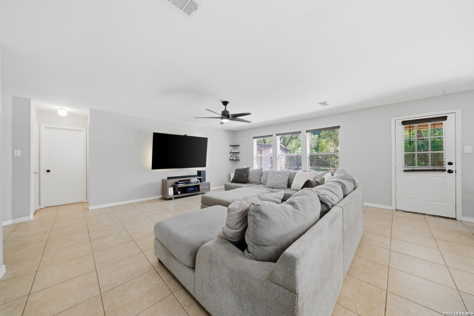 11622 Shotgun Way Helotes, TX 78023 - Photo 10 of 35 a living room with furniture and a flat screen tv