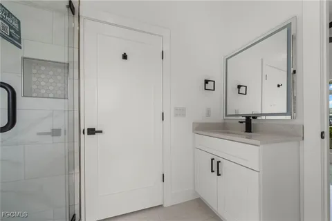 a bathroom with a shower a toilet and a shower