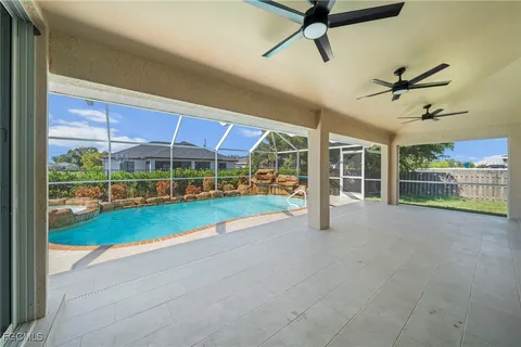 a view of a swimming pool with a patio