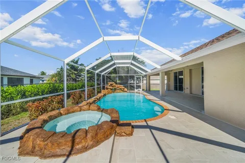 a view of a swimming pool with a patio