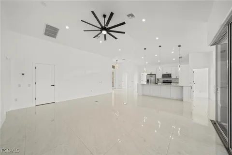 a view of kitchen with center island stainless steel appliances and cabinets