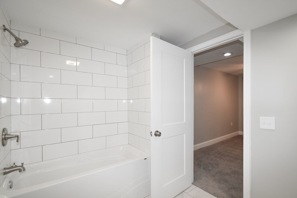 1094 Sumner Avenue Springfield, MA 01118 - Photo 12 of 35 a bathroom with a bathtub and shower