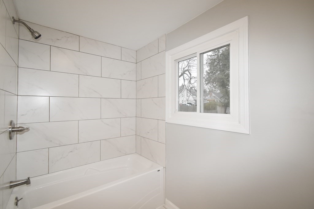 1094 Sumner Avenue Springfield, MA 01118 - Photo 13 of 35 a bathroom with a bathtub and shower