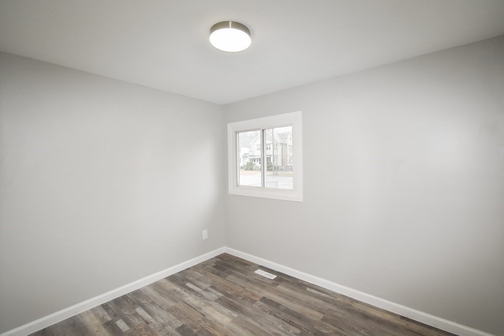 1094 Sumner Avenue Springfield, MA 01118 - Photo 14 of 35 an empty room with a window