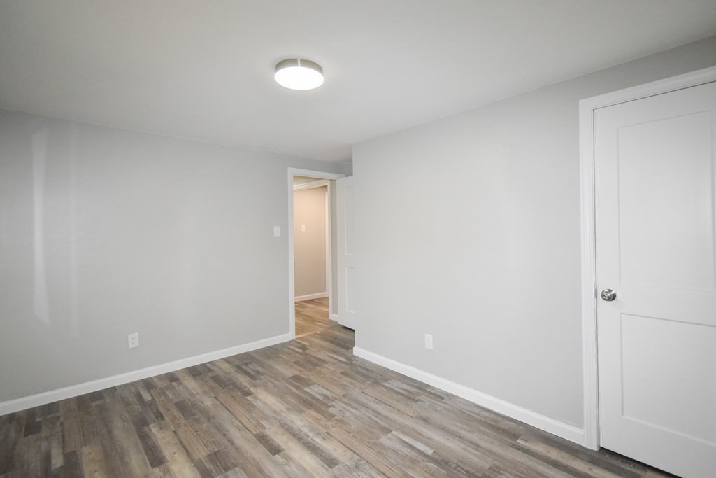 1094 Sumner Avenue Springfield, MA 01118 - Photo 15 of 35 a view of an empty room and wooden floor