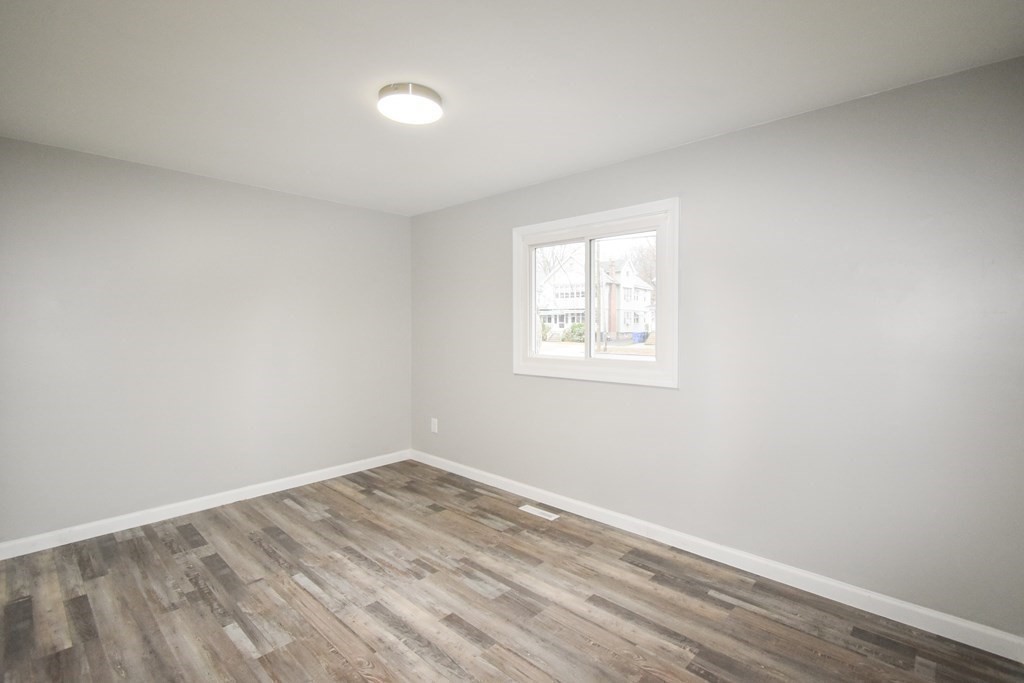 1094 Sumner Avenue Springfield, MA 01118 - Photo 17 of 35 an empty room with a window