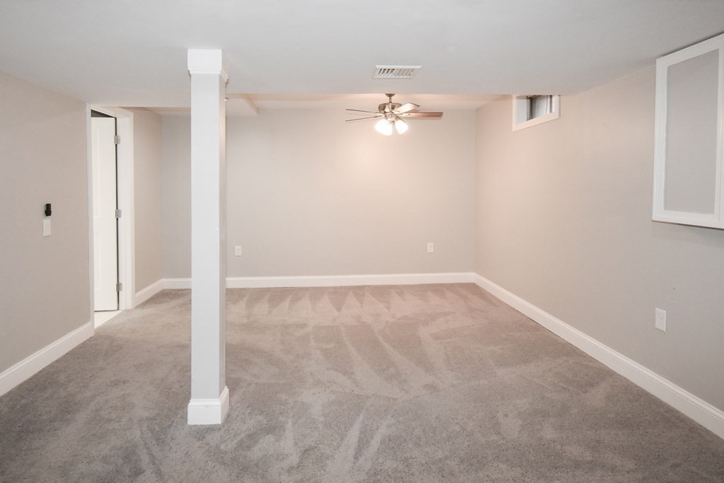 1094 Sumner Avenue Springfield, MA 01118 - Photo 18 of 35 an empty room with chandelier fan