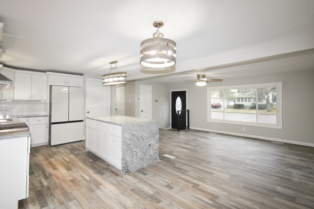 1094 Sumner Avenue Springfield, MA 01118 - Photo 2 of 35 a kitchen with stainless steel appliances granite countertop a stove and a refrigerator