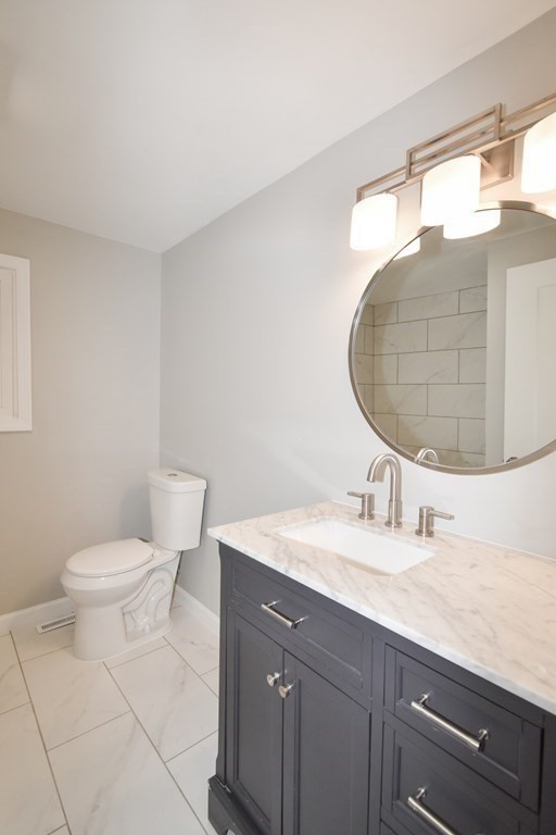 1094 Sumner Avenue Springfield, MA 01118 - Photo 22 of 35 a bathroom with a sink and a mirror