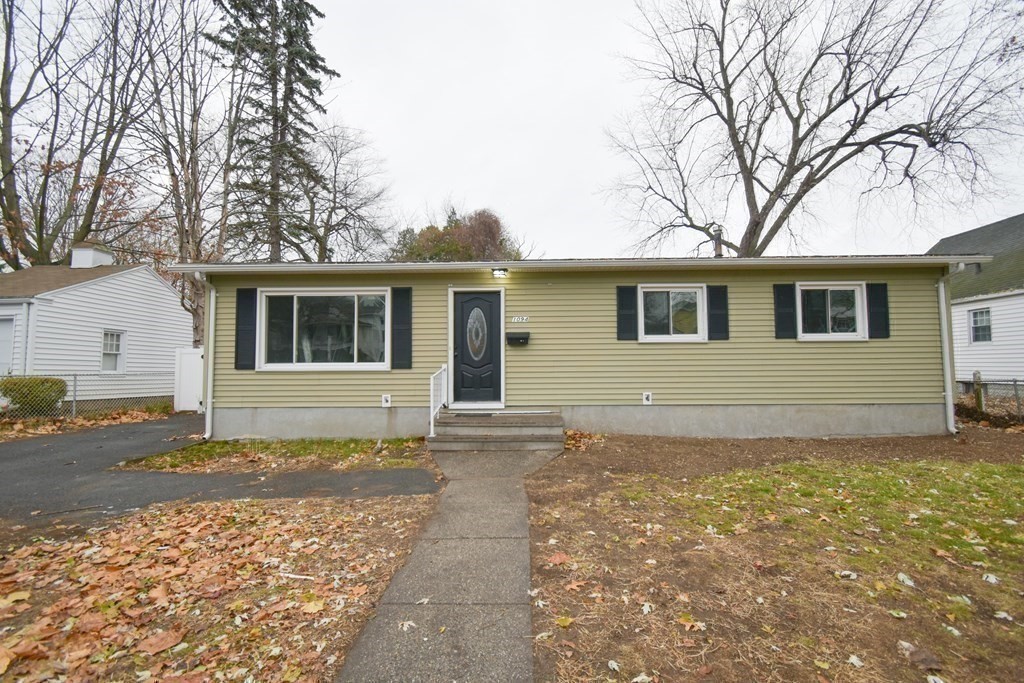 1094 Sumner Avenue Springfield, MA 01118 - Photo 24 of 35 a house with trees in the background