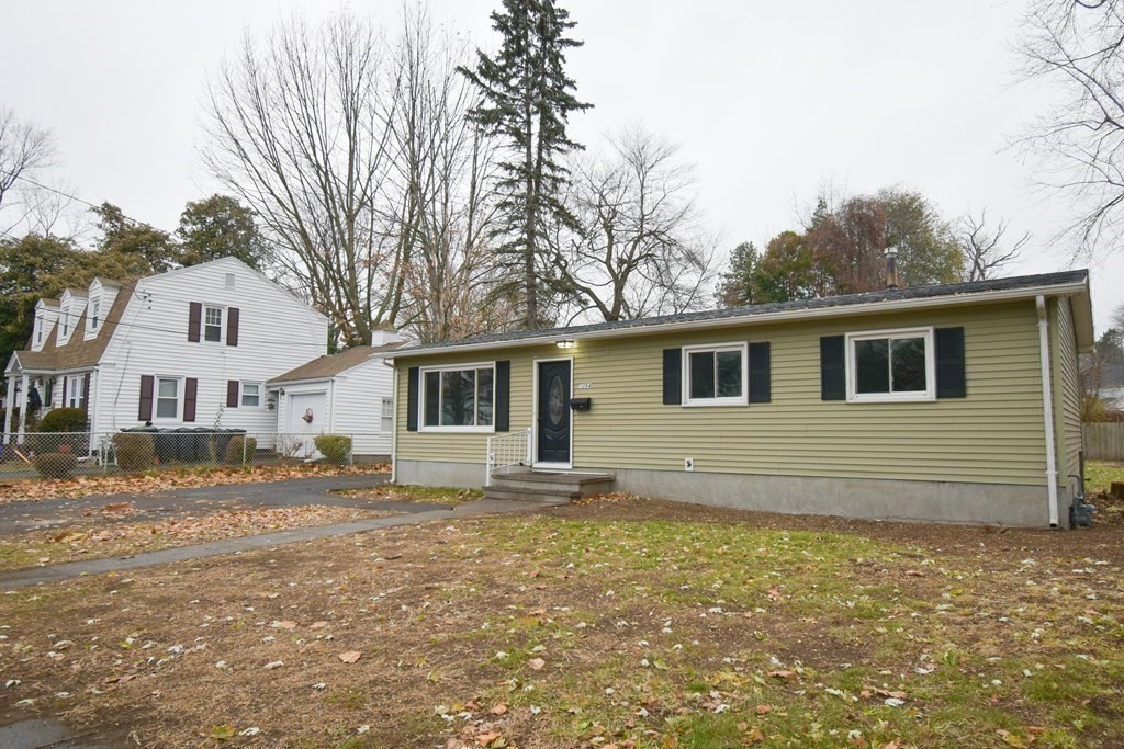 1094 Sumner Avenue Springfield, MA 01118 - Photo 25 of 35 a house that has a large tree in front of it