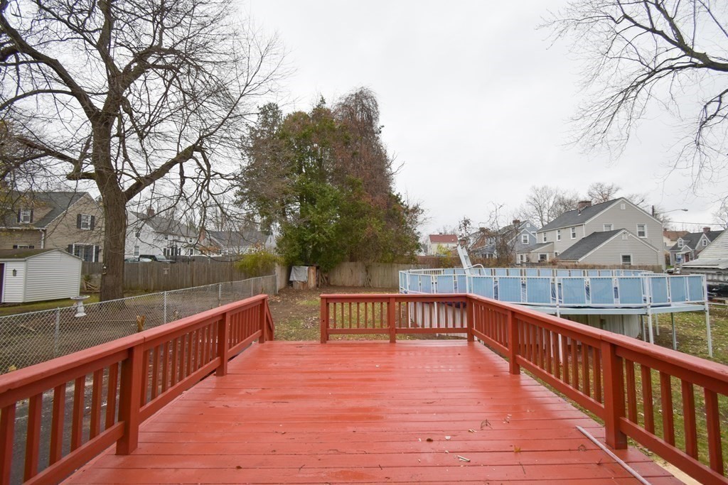 1094 Sumner Avenue Springfield, MA 01118 - Photo 26 of 35 a view of balcony with wooden floor and fence