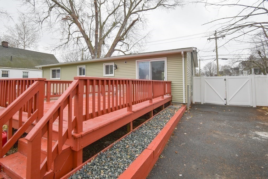 1094 Sumner Avenue Springfield, MA 01118 - Photo 29 of 35 a view of a house with a wooden deck