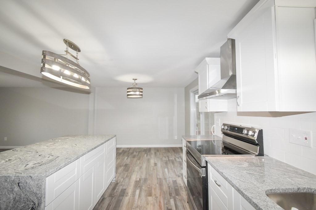 1094 Sumner Avenue Springfield, MA 01118 - Photo 3 of 35 a kitchen that has a sink and a stove