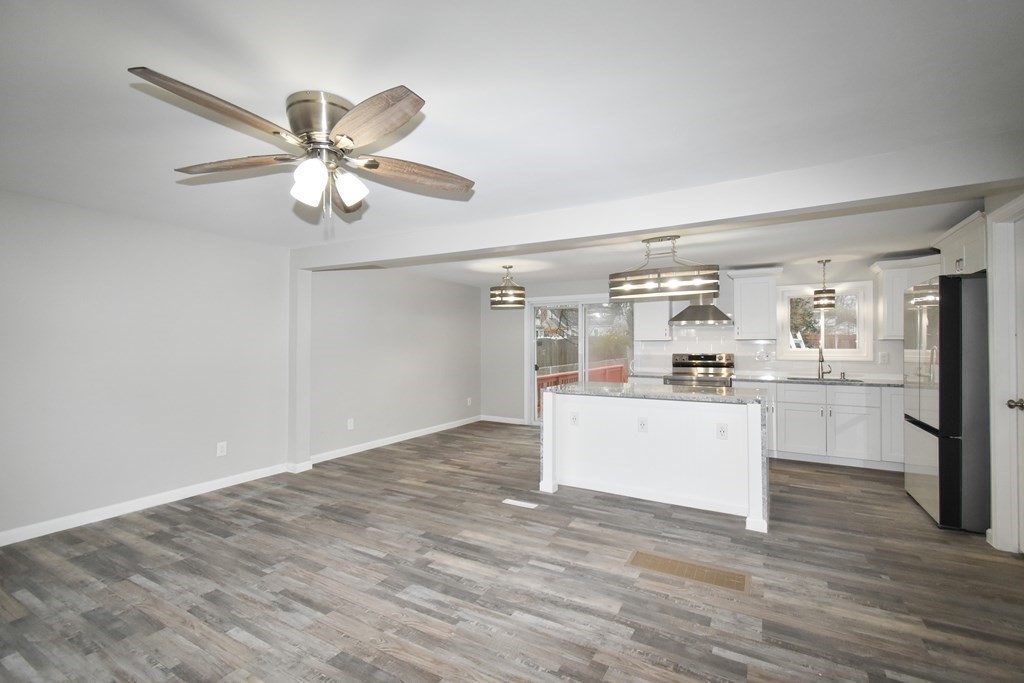 1094 Sumner Avenue Springfield, MA 01118 - Photo 9 of 35 a room with kitchen island and white appliances