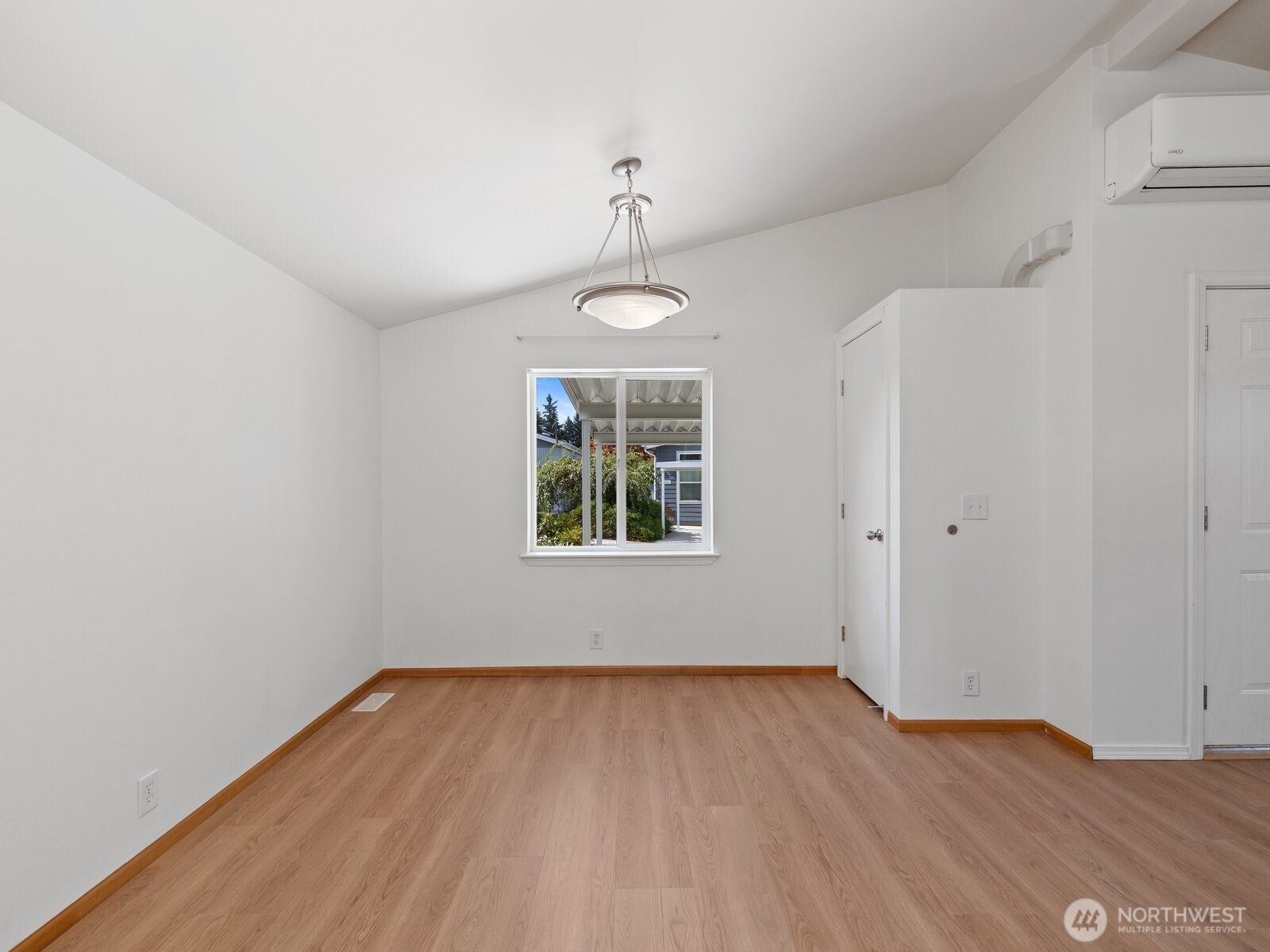 23825 15th Avenue Southeast, Unit 159 Bothell, WA 98021 - Photo 5 of 20 wooden floor in an empty room with a window