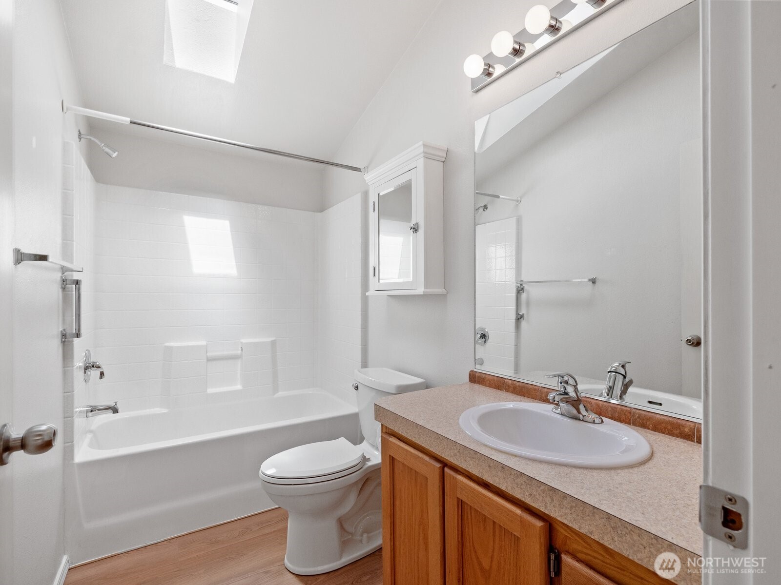 23825 15th Avenue Southeast, Unit 159 Bothell, WA 98021 - Photo 10 of 20 a bathroom with a granite countertop sink a toilet a mirror and shower