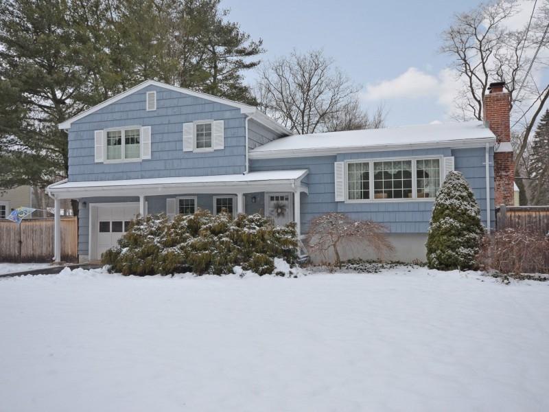 246 Tokeneke Road Darien, CT 06820 - Photo 3 of 29 a front view of a house with a yard and garage