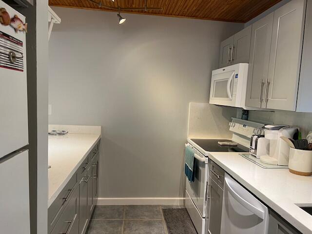 87465 Old Highway, Unit 224 Islamorada, FL 33036 - Photo 15 of 39 a utility room with a sink a washer and dryer