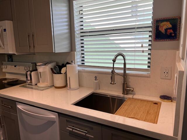 87465 Old Highway, Unit 224 Islamorada, FL 33036 - Photo 19 of 39 a kitchen with a sink and cabinets
