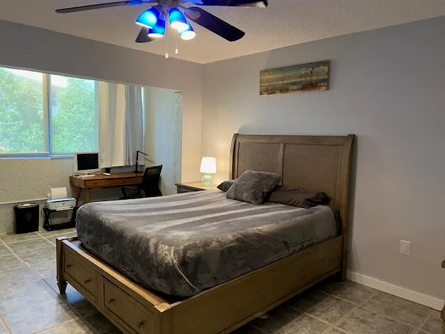 a room with a desk and a window