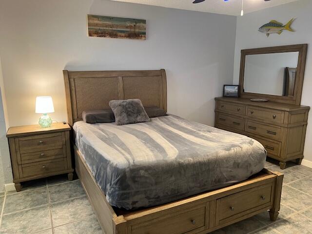 87465 Old Highway, Unit 224 Islamorada, FL 33036 - Photo 21 of 39 a bedroom with a bed and a mirror on dresser