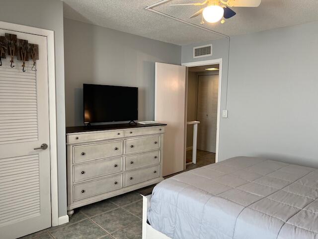 87465 Old Highway, Unit 224 Islamorada, FL 33036 - Photo 27 of 39 a bedroom with a large bed and a flat screen tv