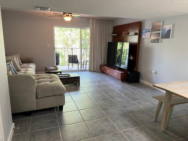 87465 Old Highway, Unit 224 Islamorada, FL 33036 - Photo 3 of 39 a living room with furniture and a flat screen tv