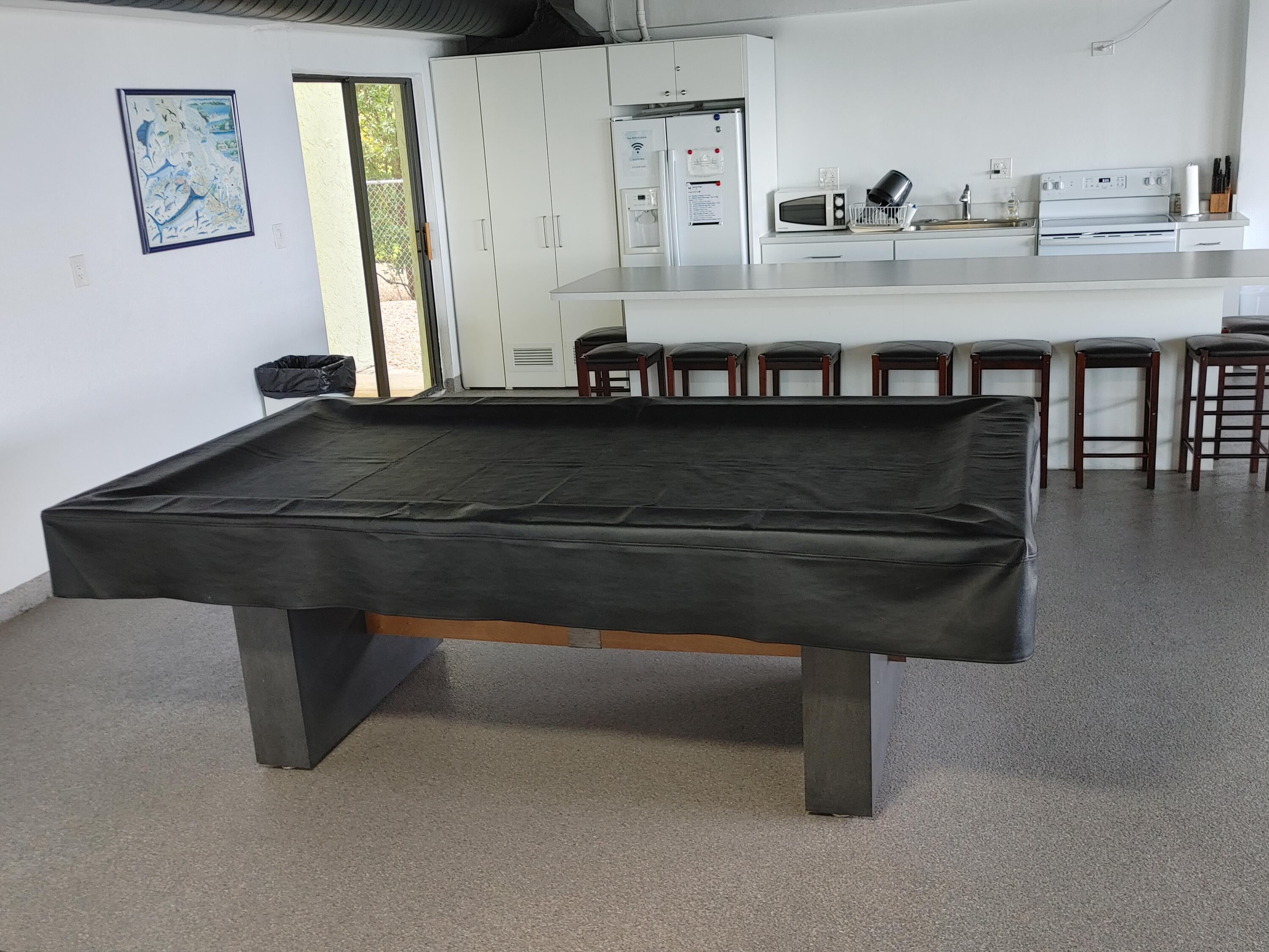 87465 Old Highway, Unit 224 Islamorada, FL 33036 - Photo 32 of 39 a living room with furniture and a table