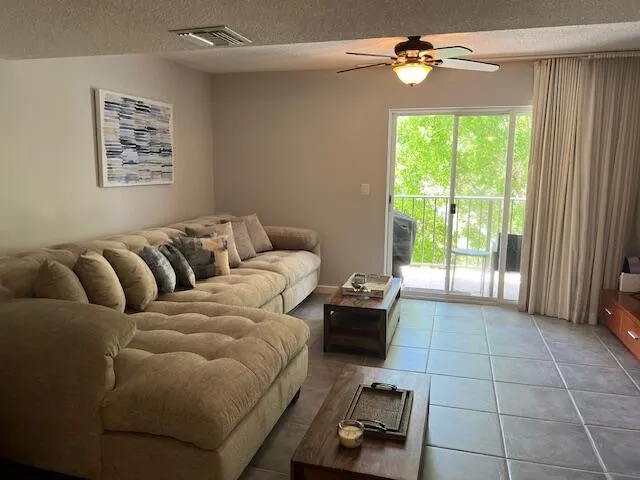 a view of a balcony with furniture