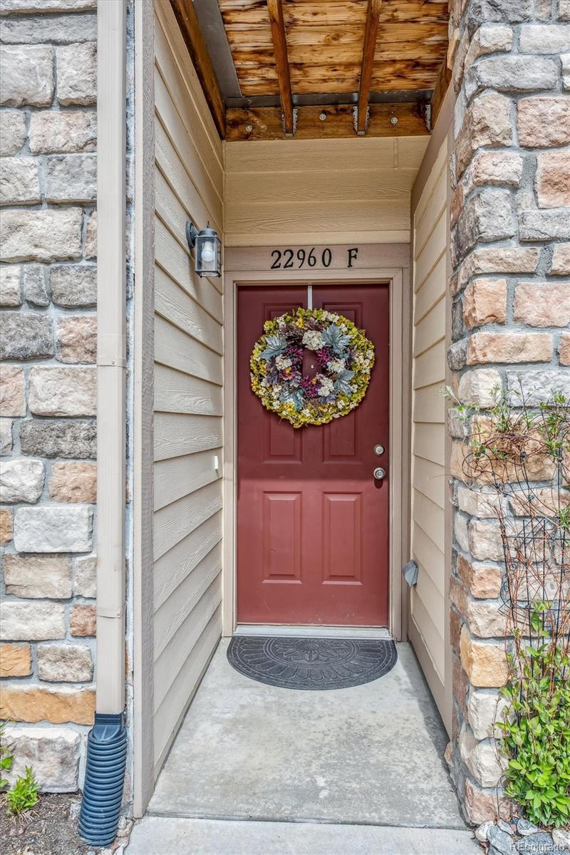22960 East Roxbury Drive, Unit F Aurora, CO 80016 - Photo 2 of 43 a view of entryway door of the house