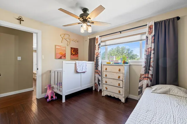 a bed room with a bed and a window