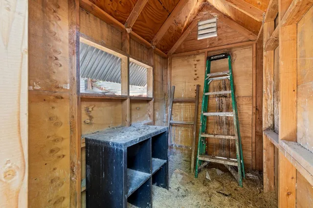 a bathroom with a granite countertop shower a sink and a mirror